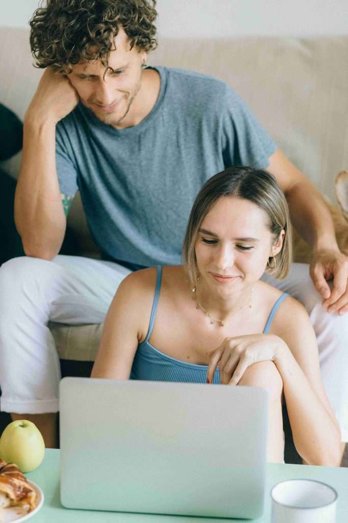 Couple on laptop website by sofa and coffee table using GROUND program by Robert Valela Psychologist Therapist Couple on laptop website by sofa and coffee table using GROUND program by Robert Valela Psychologist Therapist